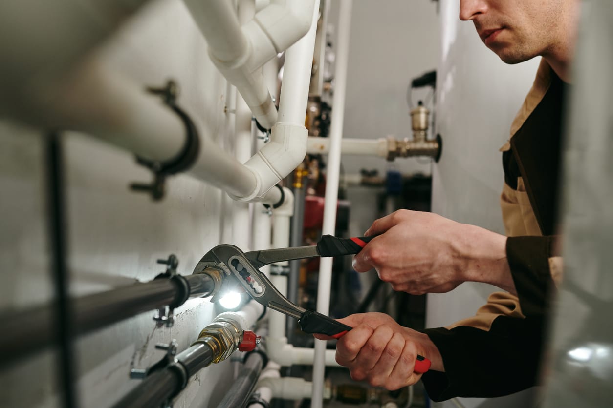 Plumbers maintaining commercial plumbing pipes in Pembroke Pines