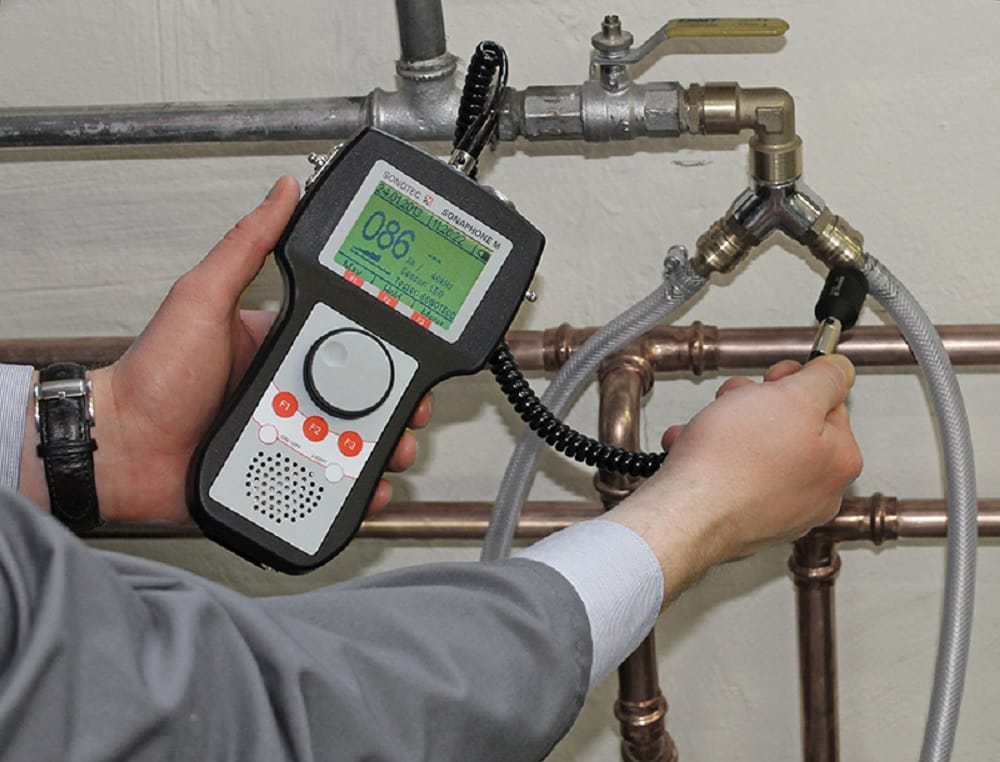 Plumber testing pipes with electronic leak detection equipment in Pembroke Pines